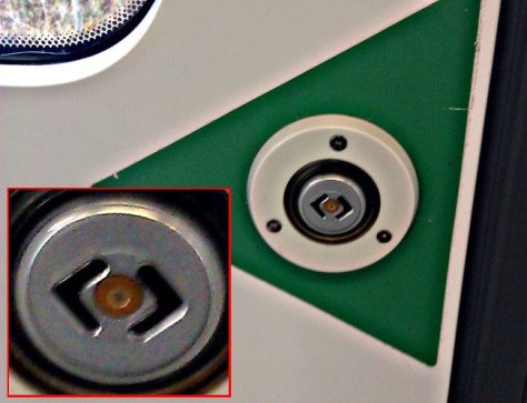 The button for opening doors in Swedish commuter trains have the Rambaldi symbol on them!