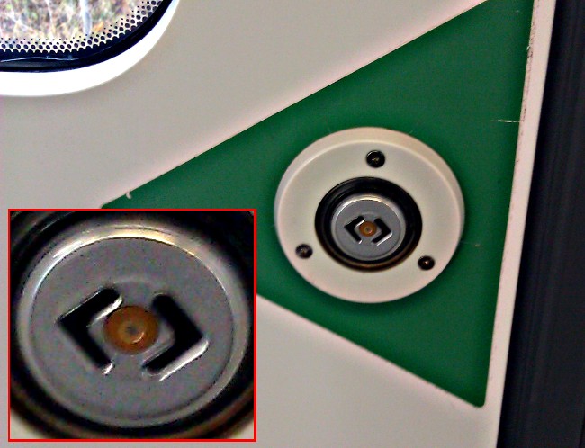 The button for opening doors in Swedish commuter trains have the Rambaldi symbol on them!